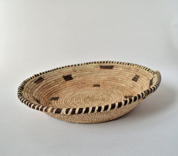 Woven straw and leather plate