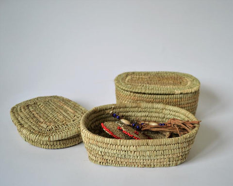 Small oval box for jewelry from palm leaves