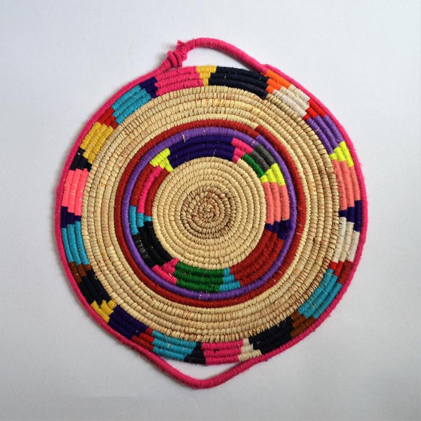Tribal woven wall basket with wool decoration