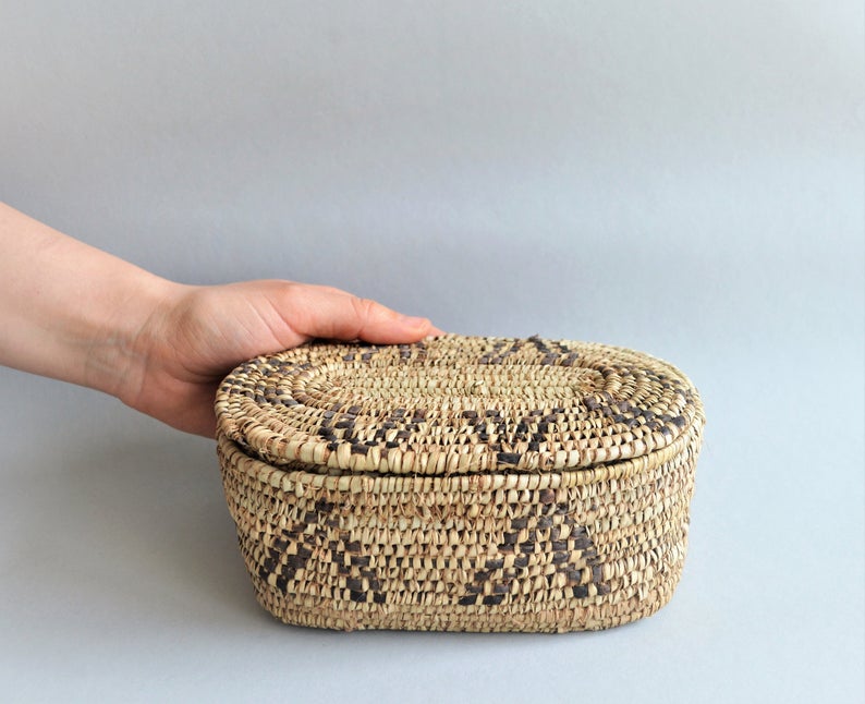 Oval box for jewelry from palm leaves and leather